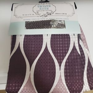 Purple shower curtain with hooks.